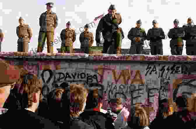 A Group Of Young People Dancing On The Berlin Wall As It Falls The Last Dance Over The Berlin Wall